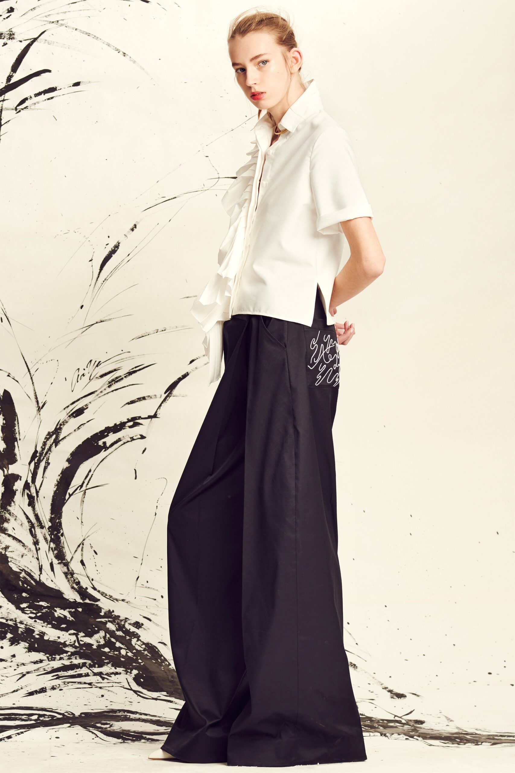 white cotton short-sleeve collared relaxed ruffled blouse