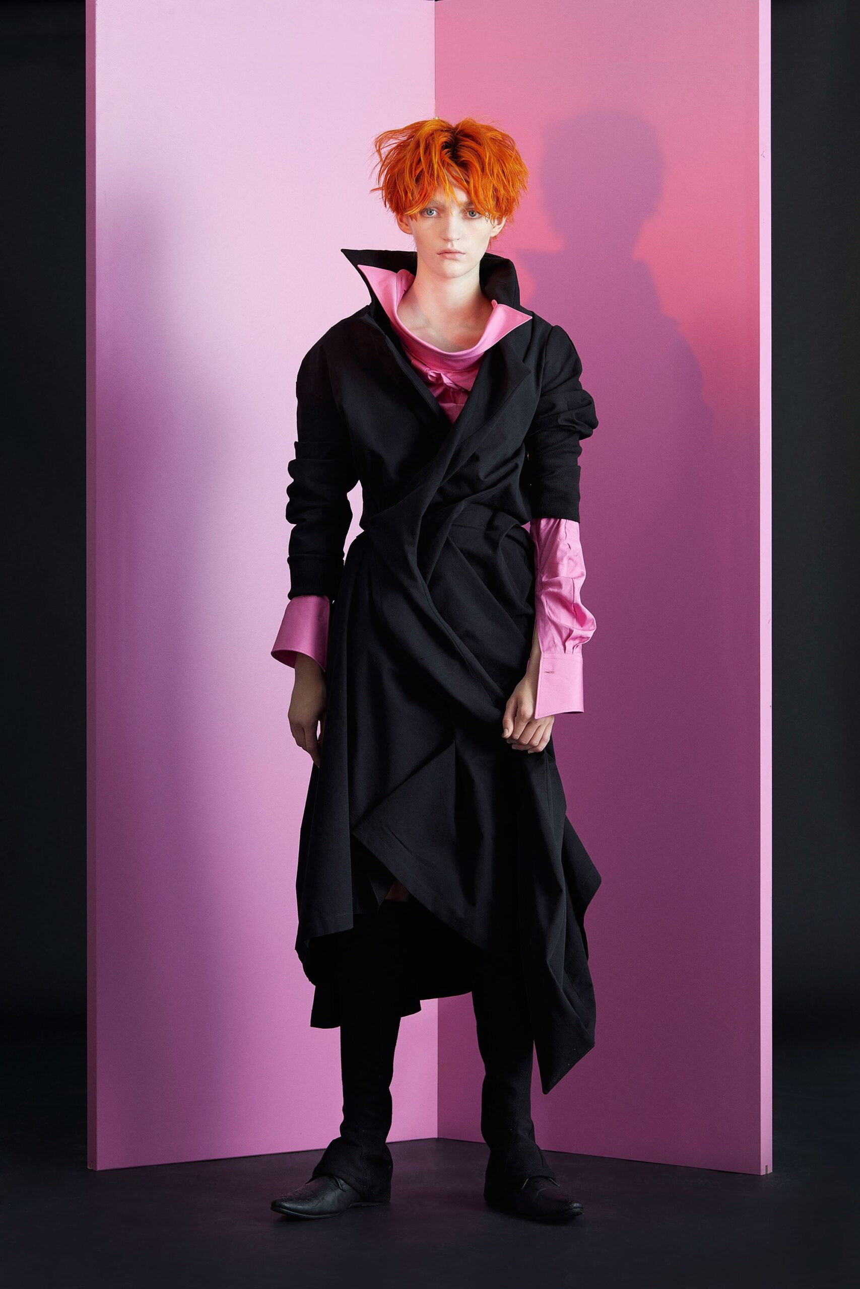 black coat and pink shirt
