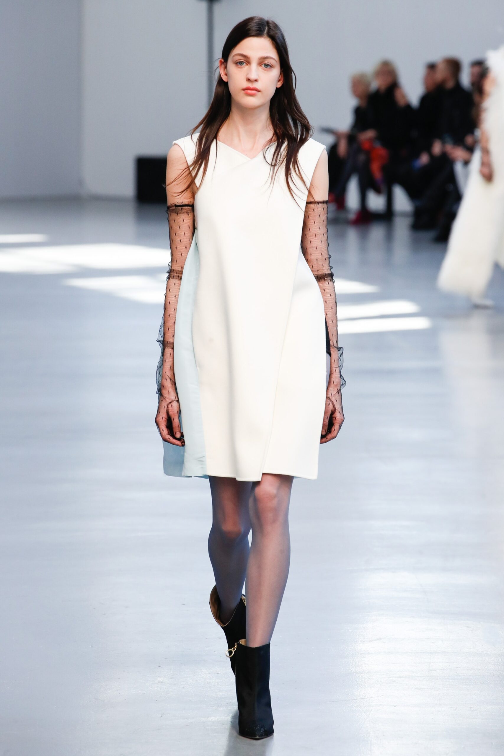 white mini dress with black gloves