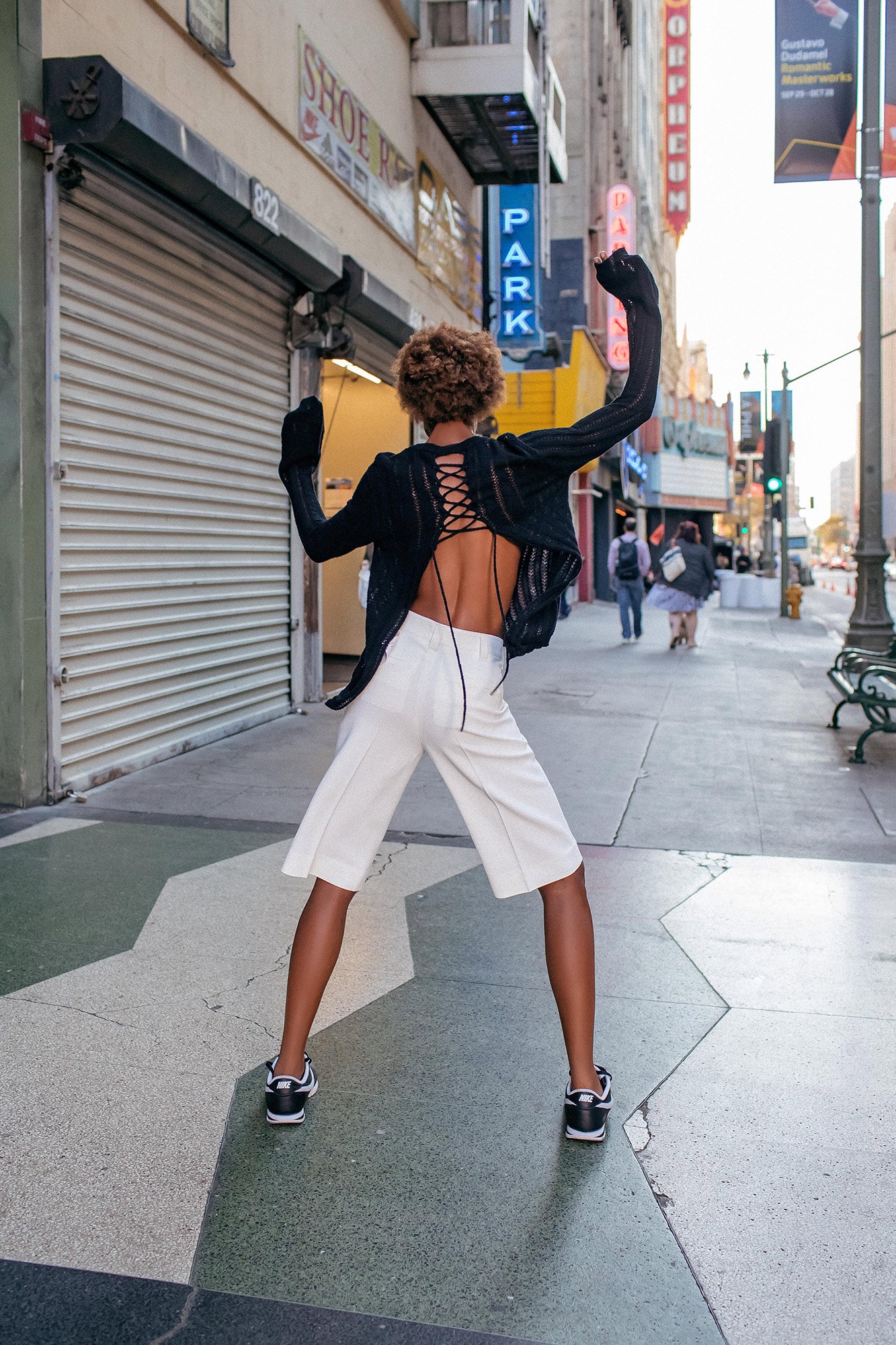 black fitted top and white shorts