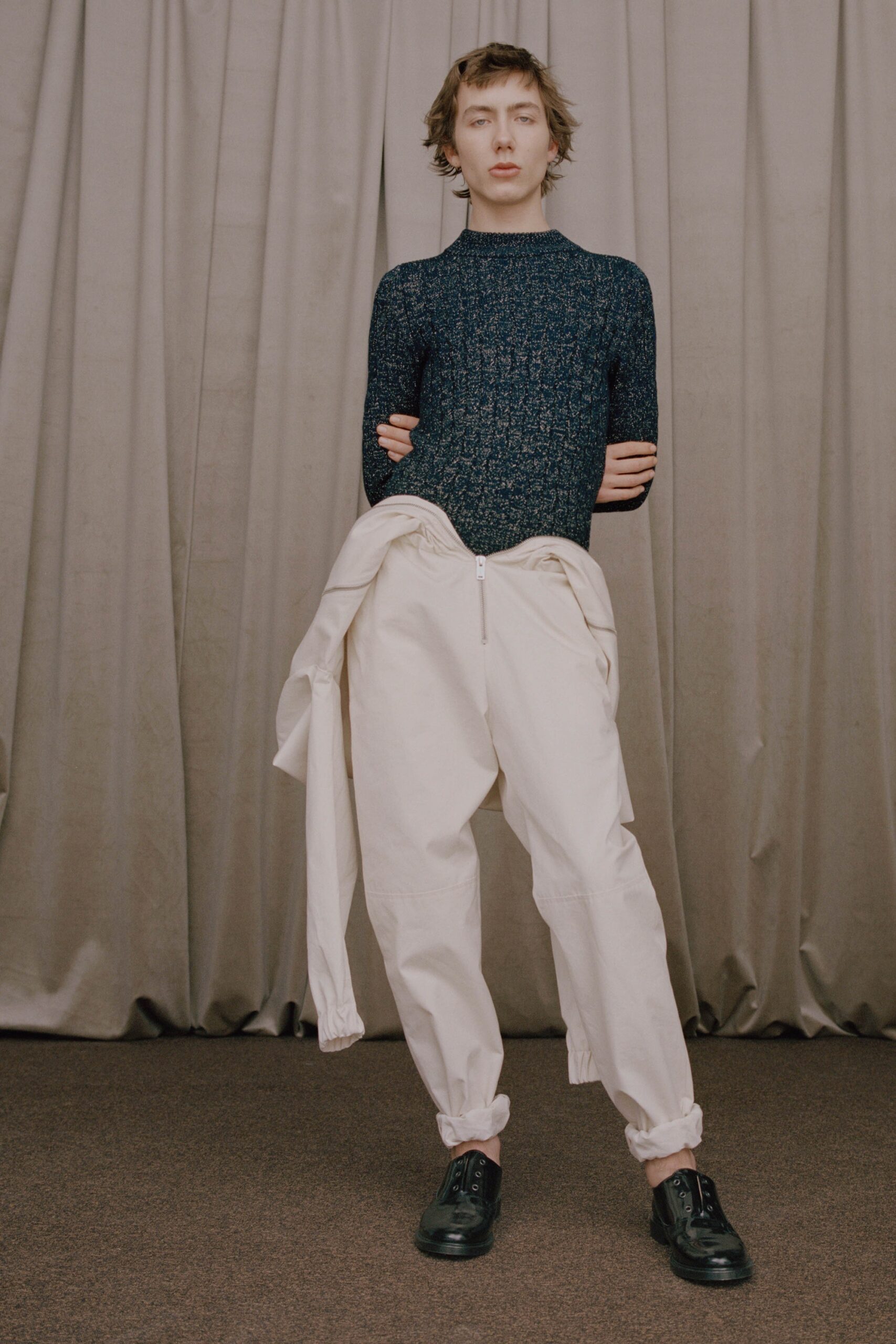 fitted blue top and relaxed white pants