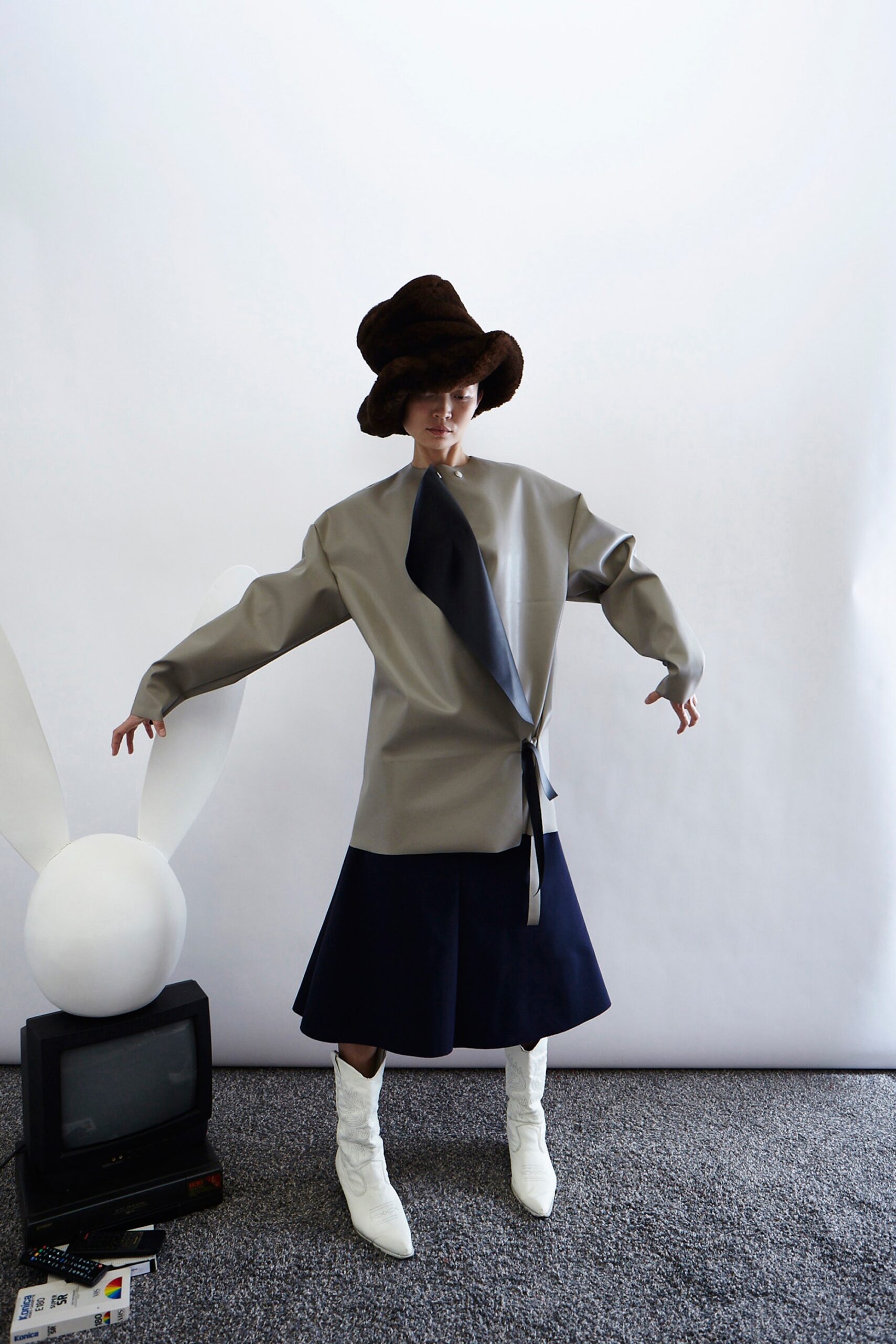 gray relaxed asymmetric dress with brown hat
