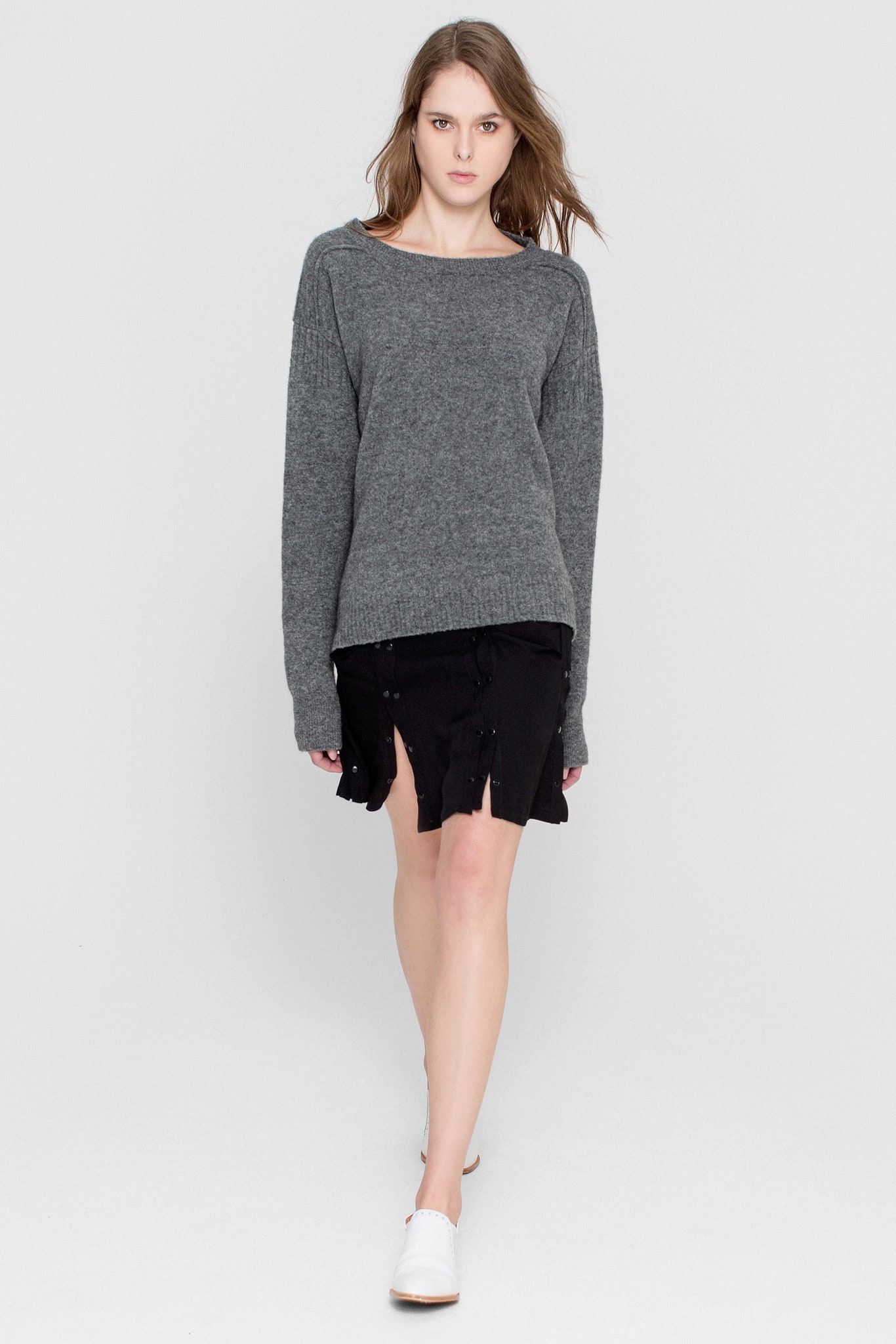gray relaxed sweater with black skirt