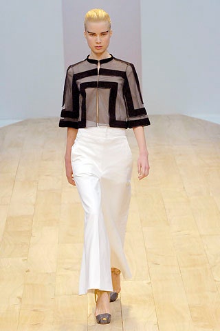 black silk fitted top and white tailored pants