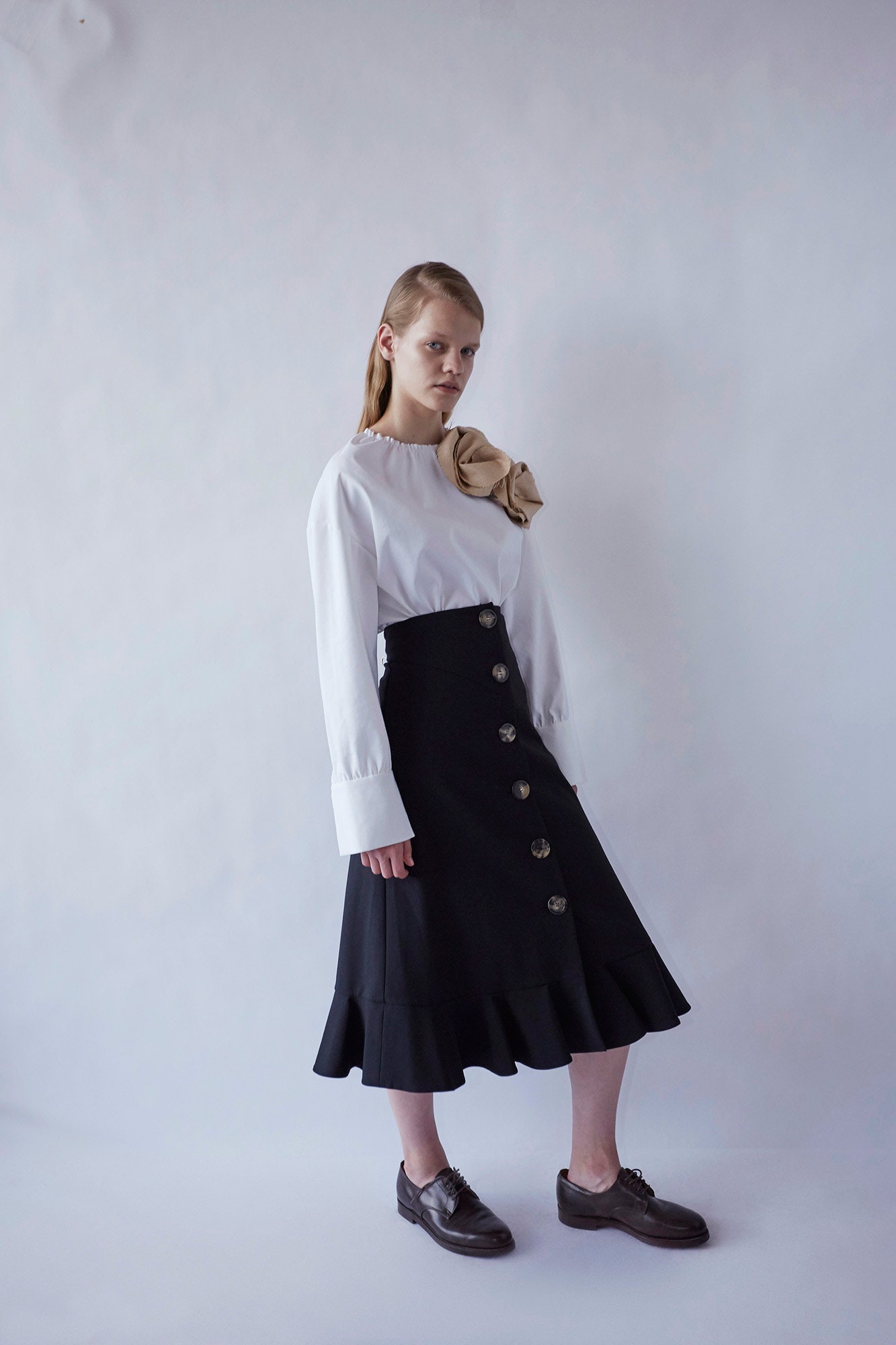 black cotton fitted high-waisted flared buttoned midi skirt