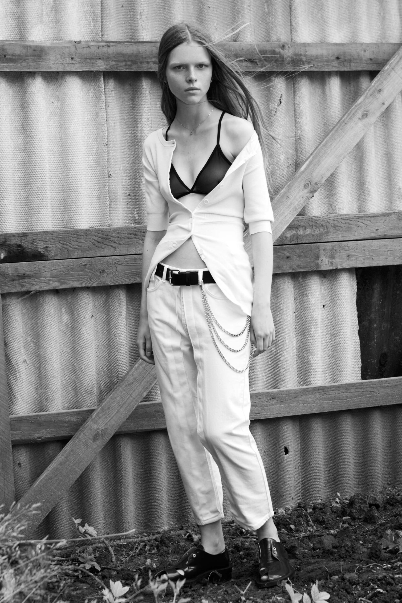 white fitted blazer with black bra