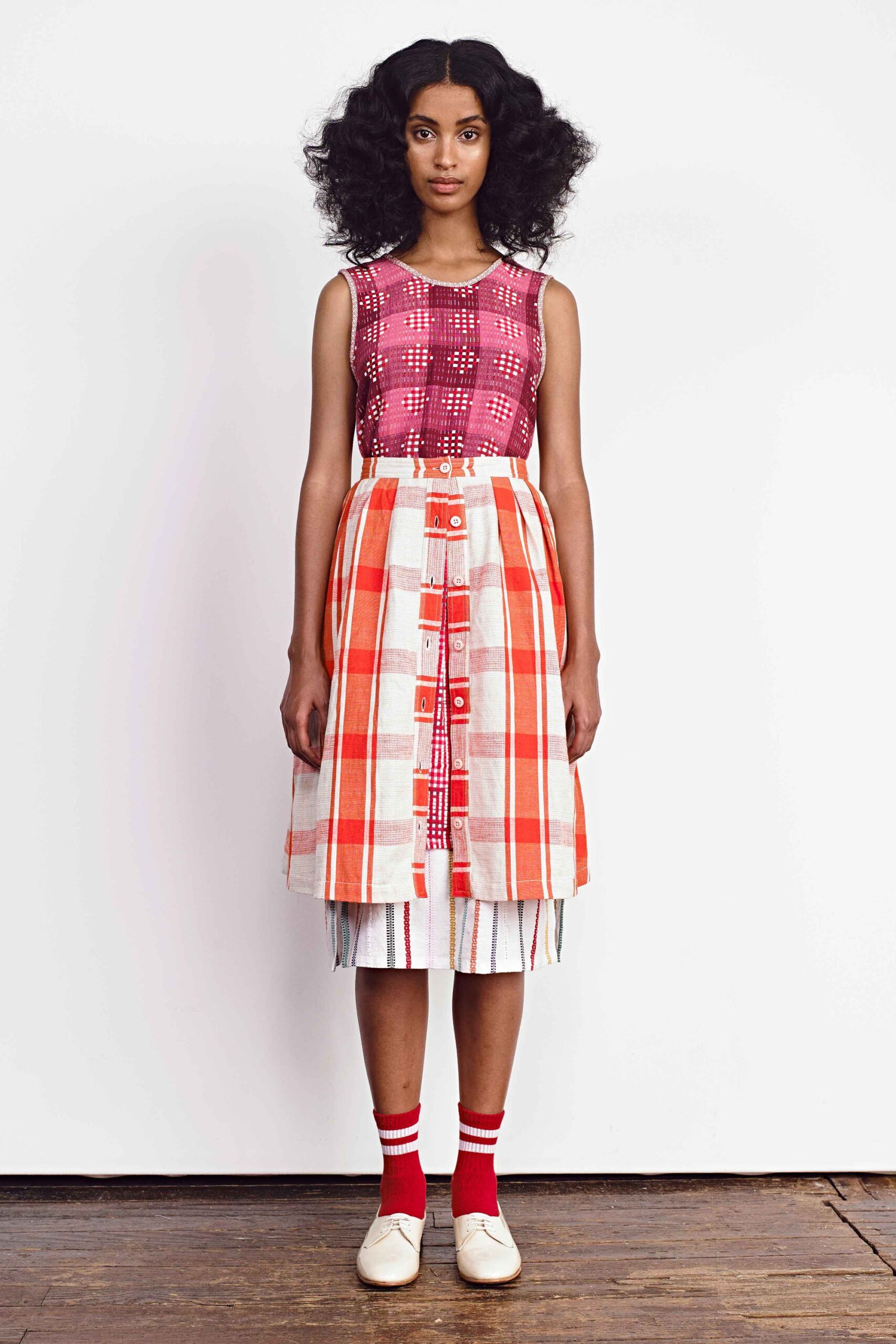 red cotton sleeveless collared fitted pleated buttoned dress
