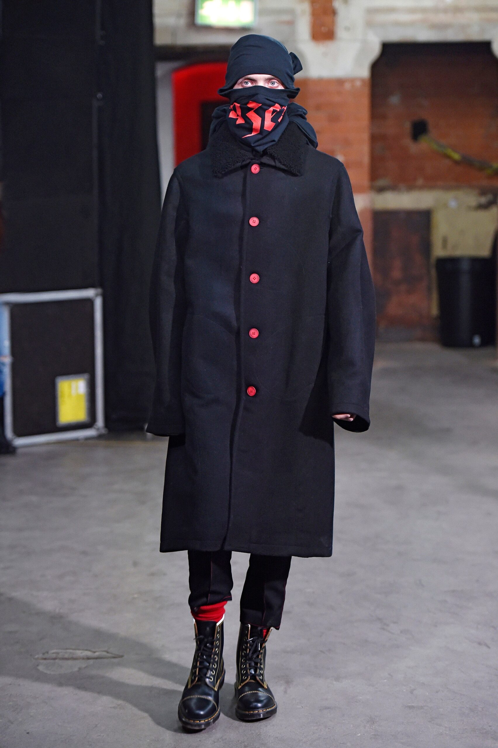 black wool coat with red accents