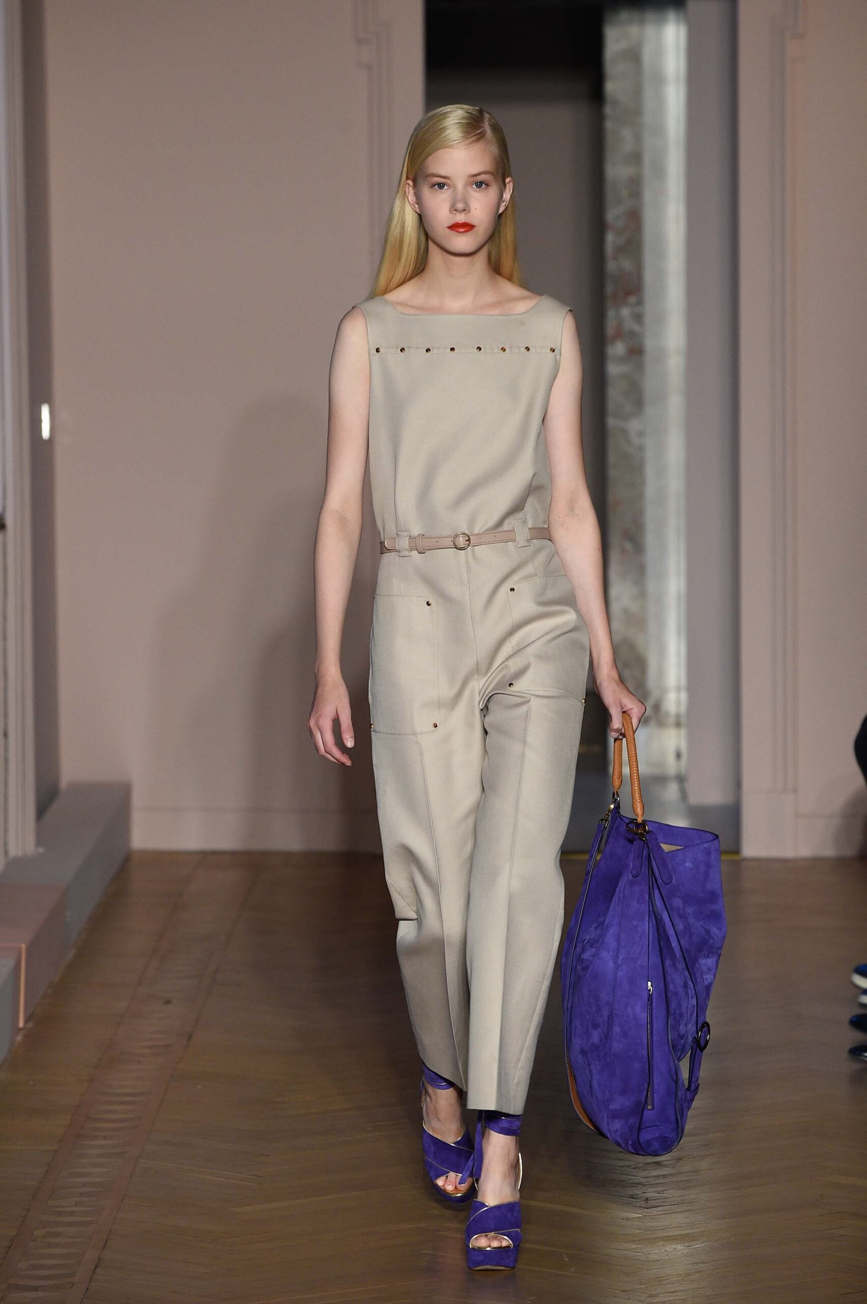 beige fitted jumpsuit with blue shoes