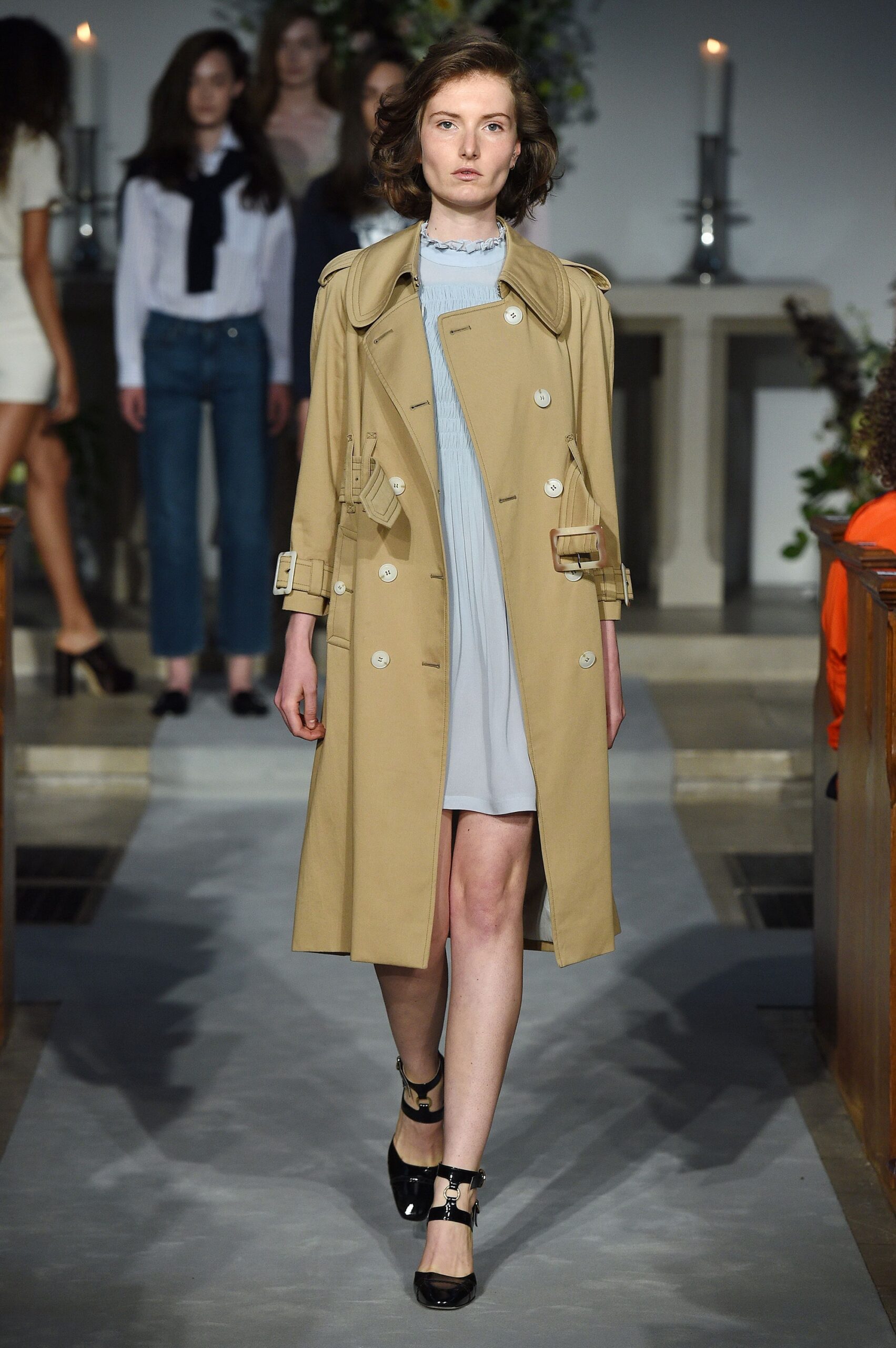 beige trench coat and blue dress