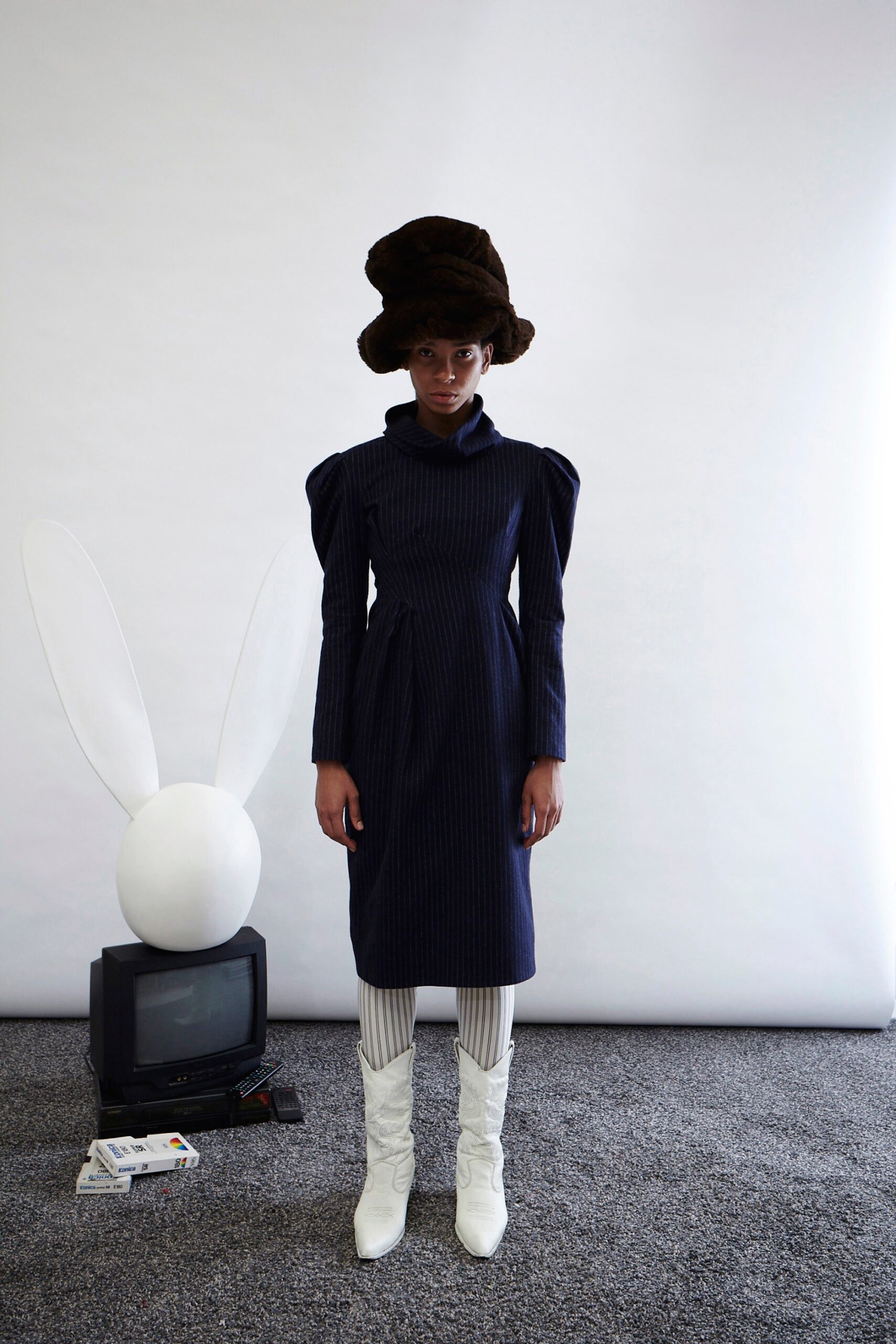 blue fitted midi dress with white boots
