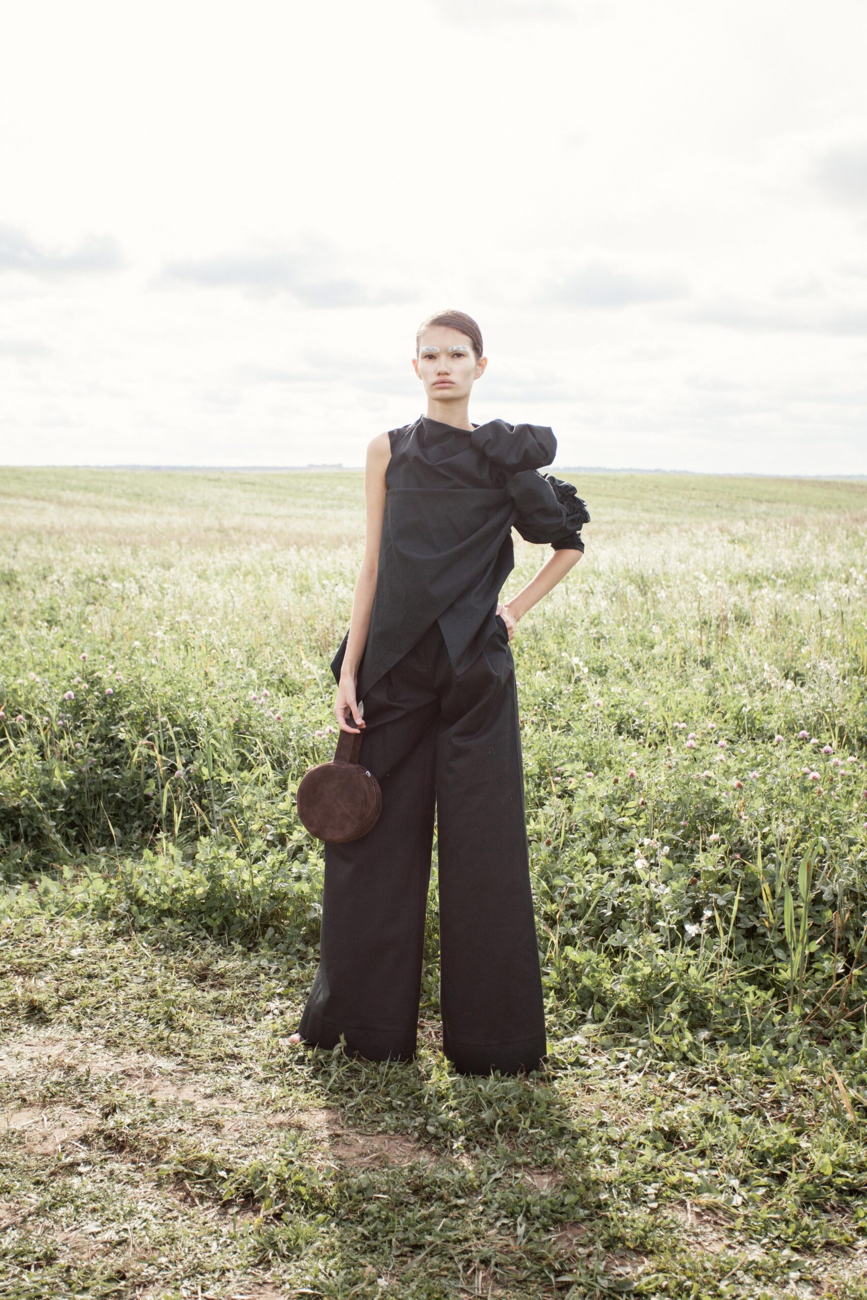 black fitted top and relaxed pants