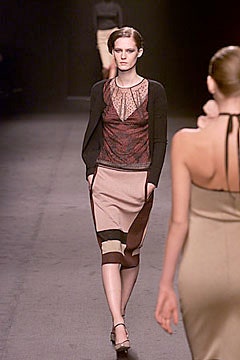 fitted black silk top with layered skirt
