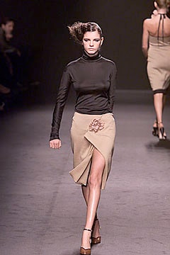 black fitted turtleneck top and beige pencil skirt