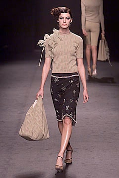 beige fitted top with black pencil skirt