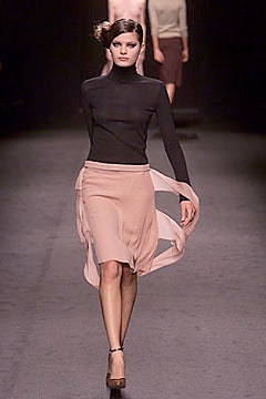 black silk turtleneck top and pink chiffon skirt