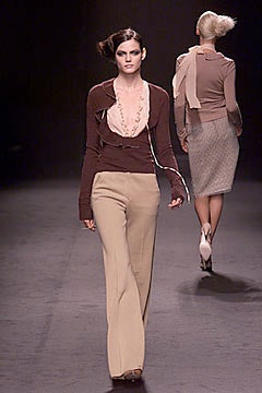 brown silk fitted top and beige flared pants
