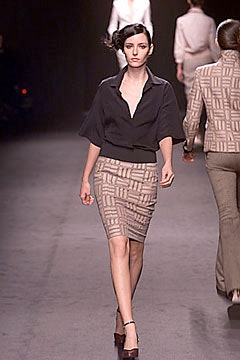 black fitted blouse and beige pencil skirt