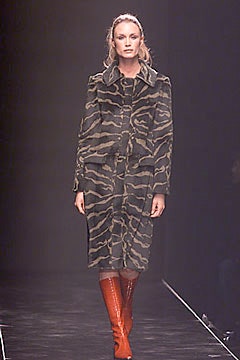 green camouflage coat with red boots