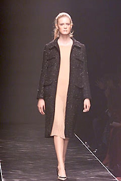 black wool coat and beige silk dress