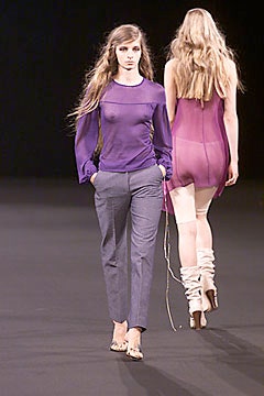 purple silk fitted top and gray tailored pants