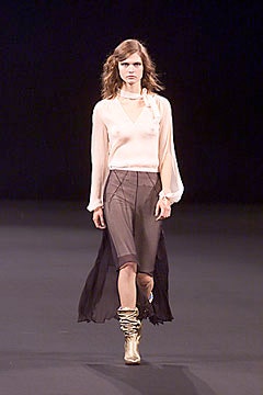 pink silk blouse with brown skirt