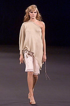 beige asymmetric top with white shorts