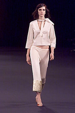 white fitted top with beige pants