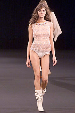 beige lace bodysuit with white boots