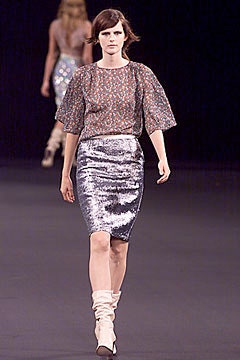 multi-colored ruffled top with silver pencil skirt