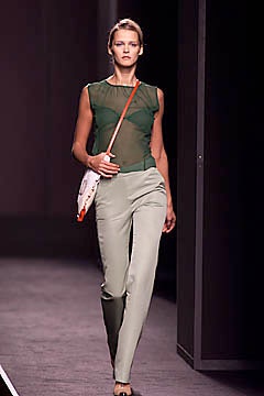 fitted green mesh top and tailored beige pants