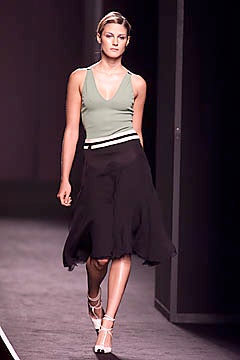 fitted green top and black skirt