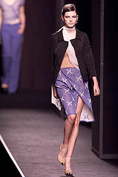 black jacket beige top blue skirt