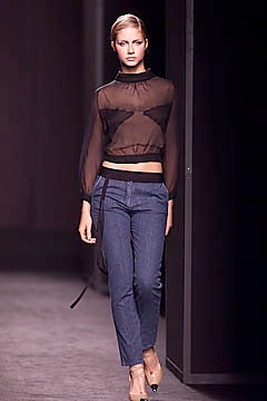 black sheer top and blue jeans