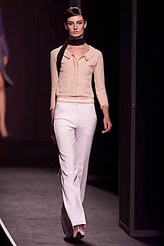 beige fitted top with white tailored pants