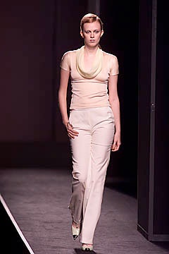 beige silk fitted top and white tailored pants