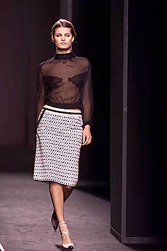 black sheer blouse and polka-dot skirt