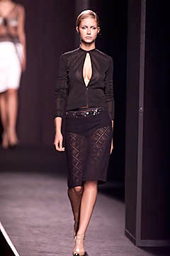 black fitted jacket and lace skirt