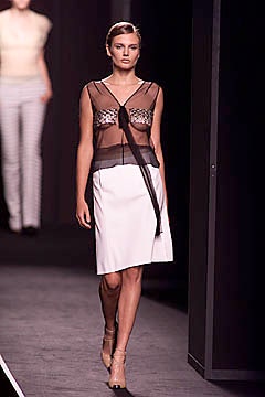 sheer black top with asymmetric white skirt
