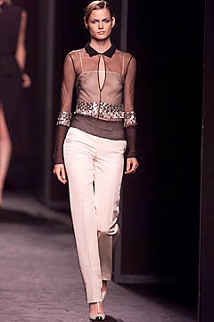 fitted brown blouse with tailored white pants