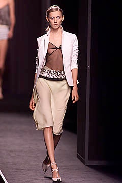 white blazer black top beige skirt
