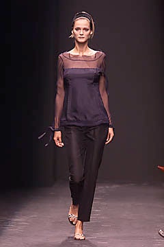 black sheer long-sleeve top with tailored pants