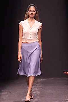 white silk blouse with blue skirt
