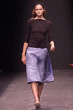 black fitted top with blue skirt