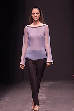 blue sheer off-shoulder top with black pants