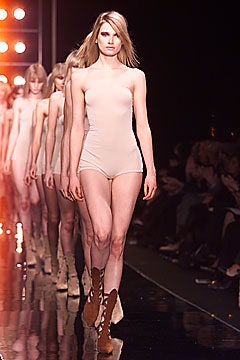 beige cotton sleeveless high-neck fitted bodysuit