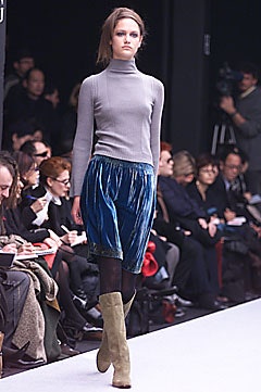 gray wool turtleneck top with blue pleated skirt