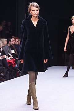 black wool fitted coat with beige boots