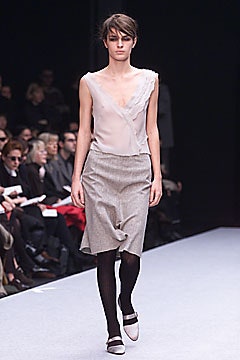 white silk sleeveless top and gray pencil skirt