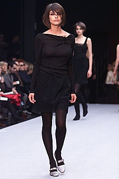 black fitted top and mini skirt